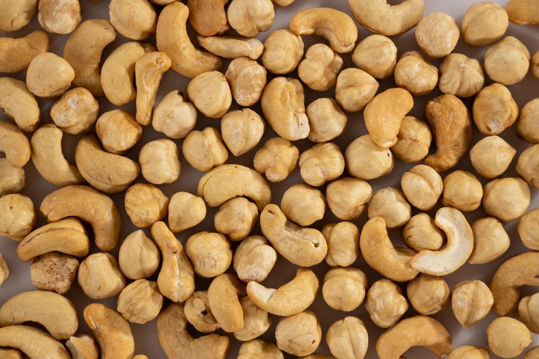 Close-up of assorted cashew and macadamia nuts, showcasing texture and variety. - keto instant pot recipes