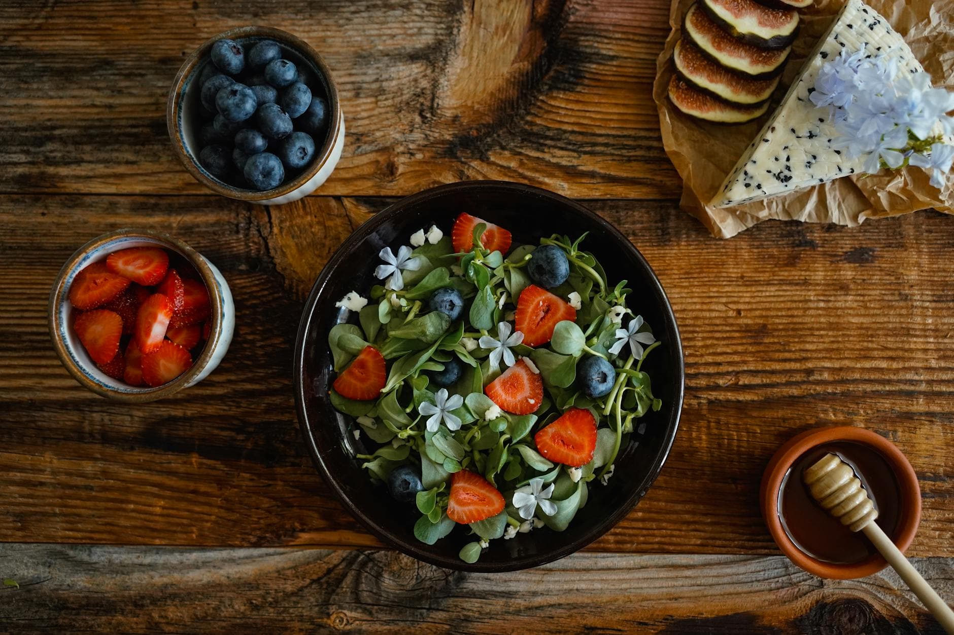 Healthy fruit and salad arrangement on rustic wooden table. Perfect for organic food concepts. - healthy spring salads