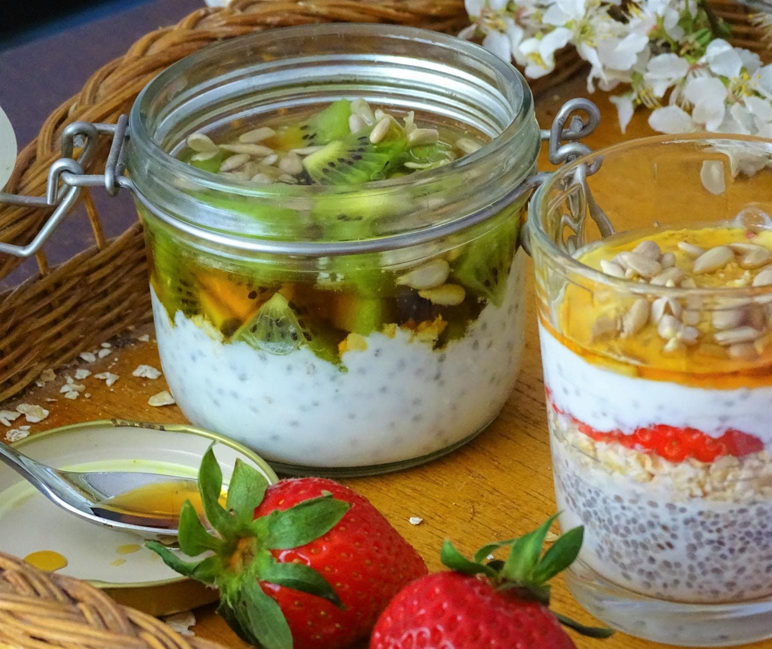 Delicious chia seed parfaits topped with fresh kiwi, strawberries, and sunflower seeds. - probiotic foods spring