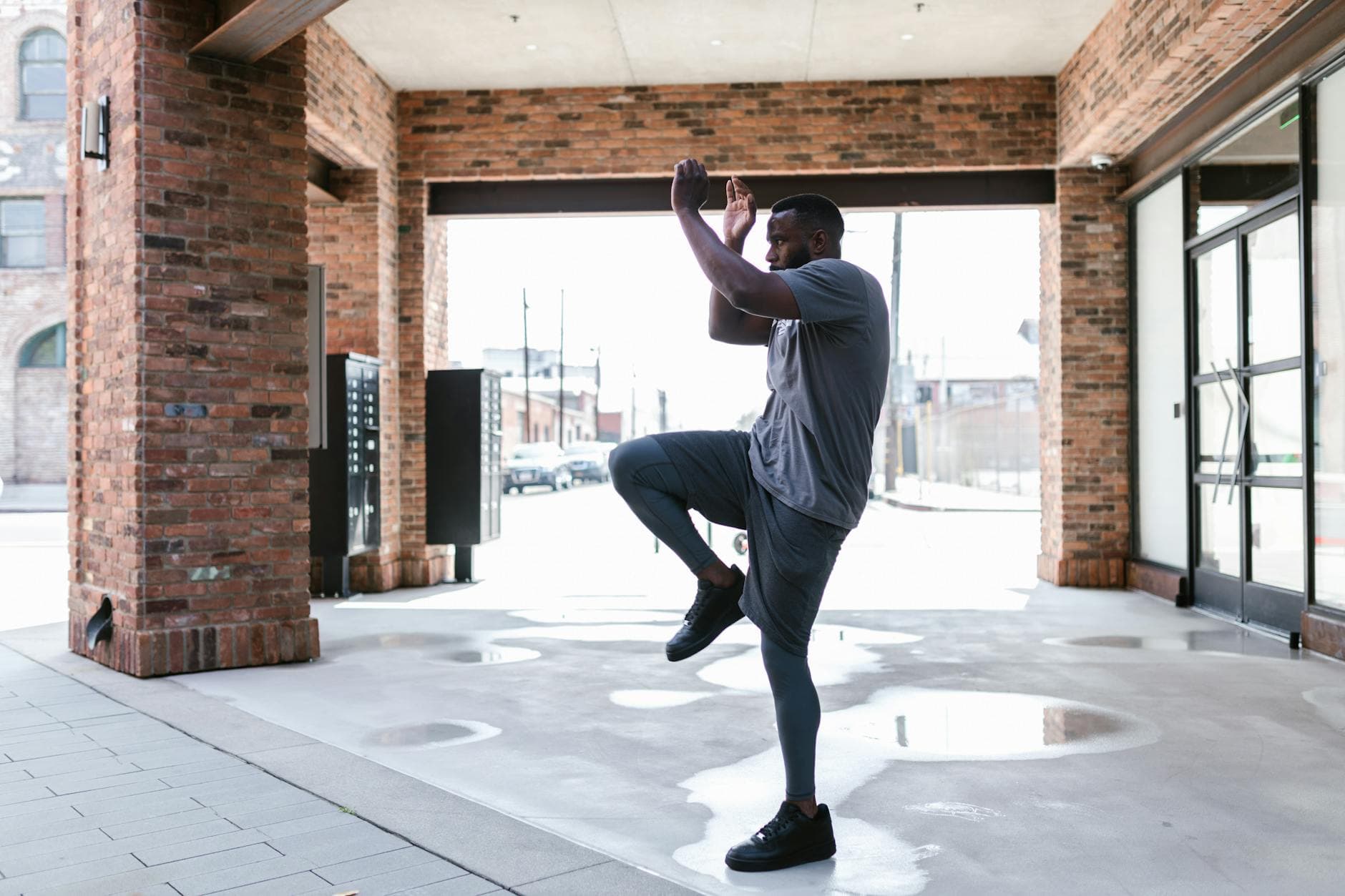 Fit man performing calisthenics exercise outdoors, displaying strength and focus. - spring strength moves