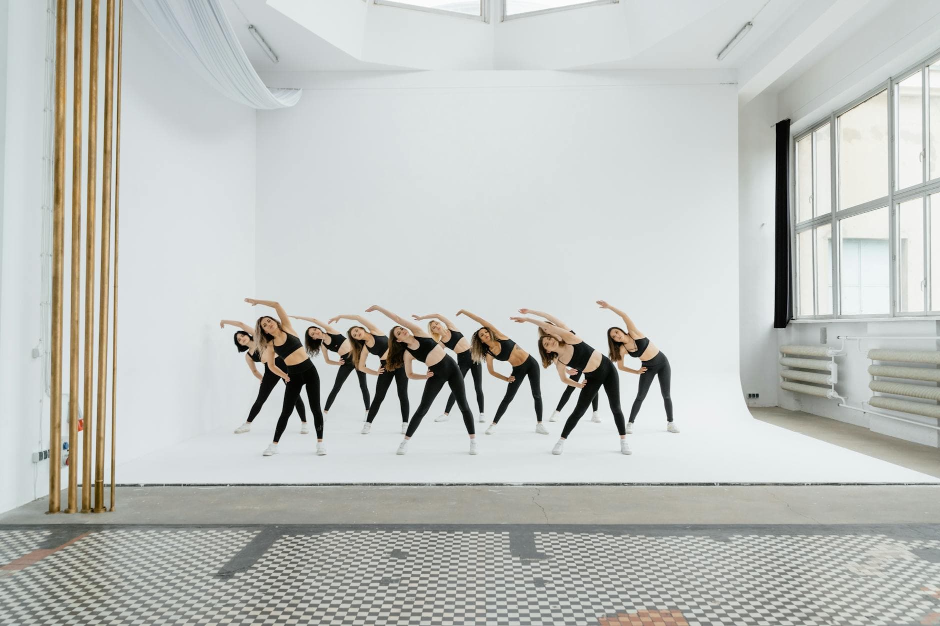 Group of women exercising in a bright studio space. Perfect for fitness and lifestyle themes. - daily stretching routine