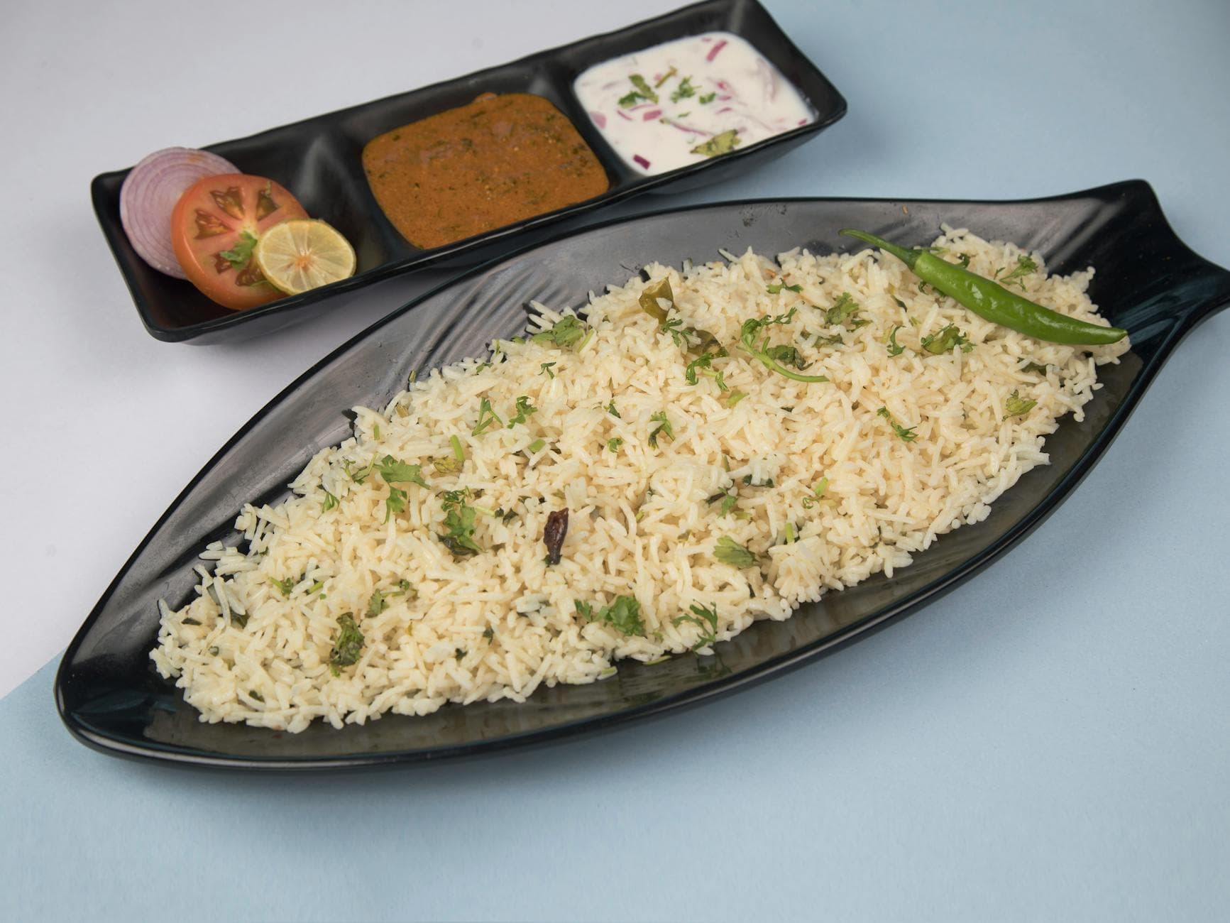 Freshly prepared jeera rice served with chutney, yogurt, and salad. - healthy lunch recipes