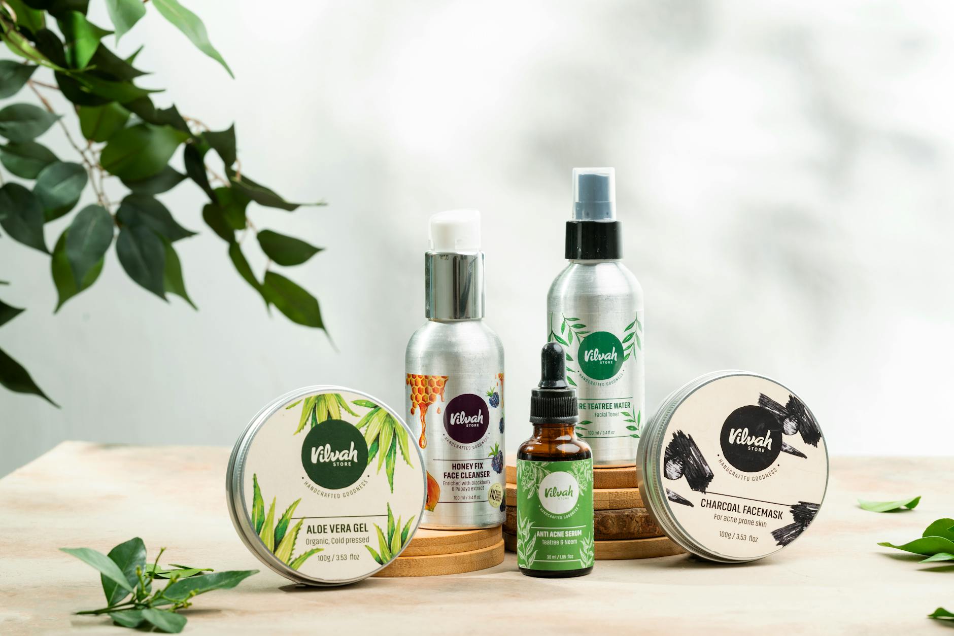 Close-up of natural skincare products including aloe vera gel and charcoal face mask. - best natural skincare products