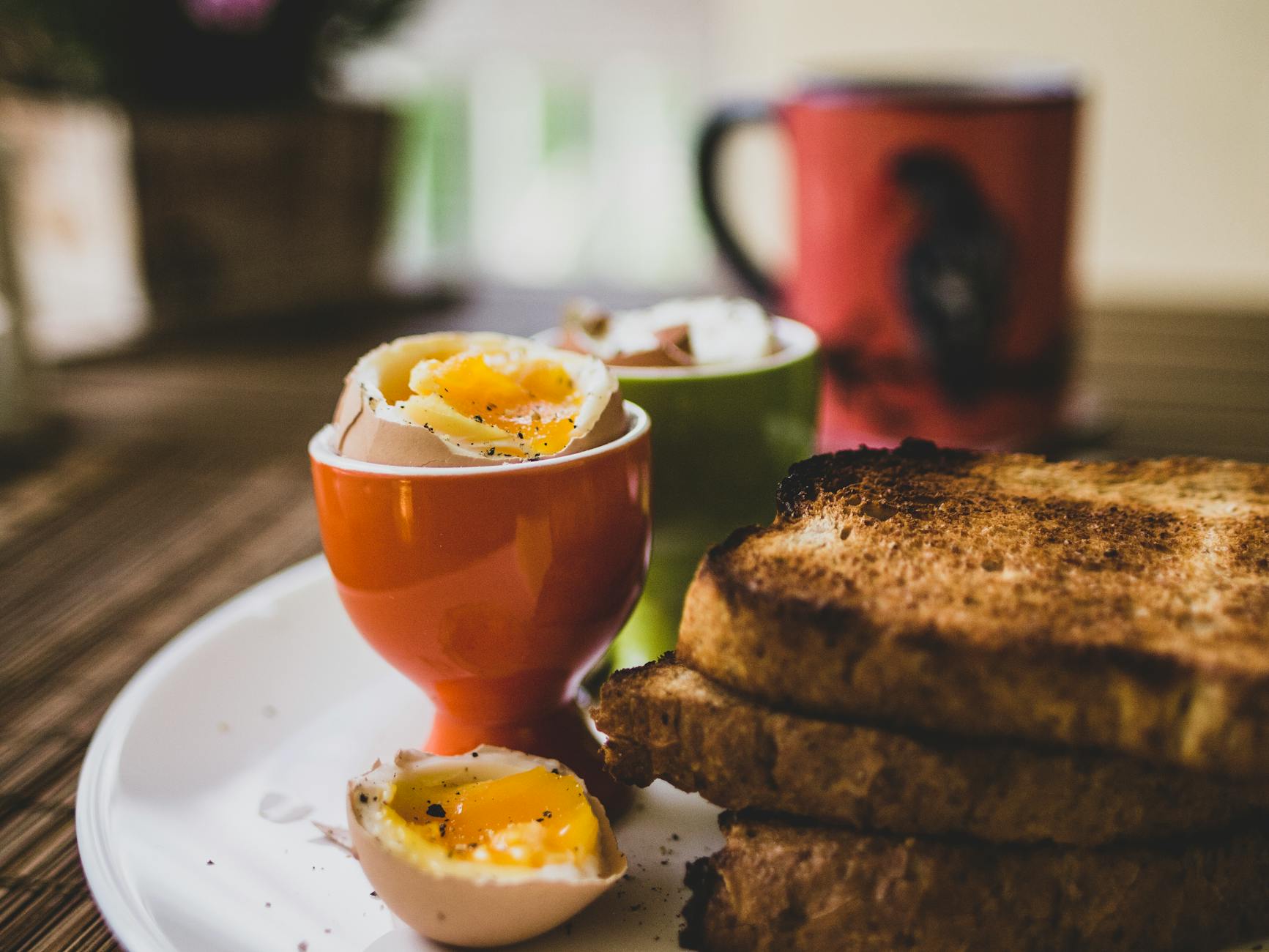 Delicious breakfast featuring soft-boiled eggs and toasted bread, perfect start to the day. - healthy breakfast near me