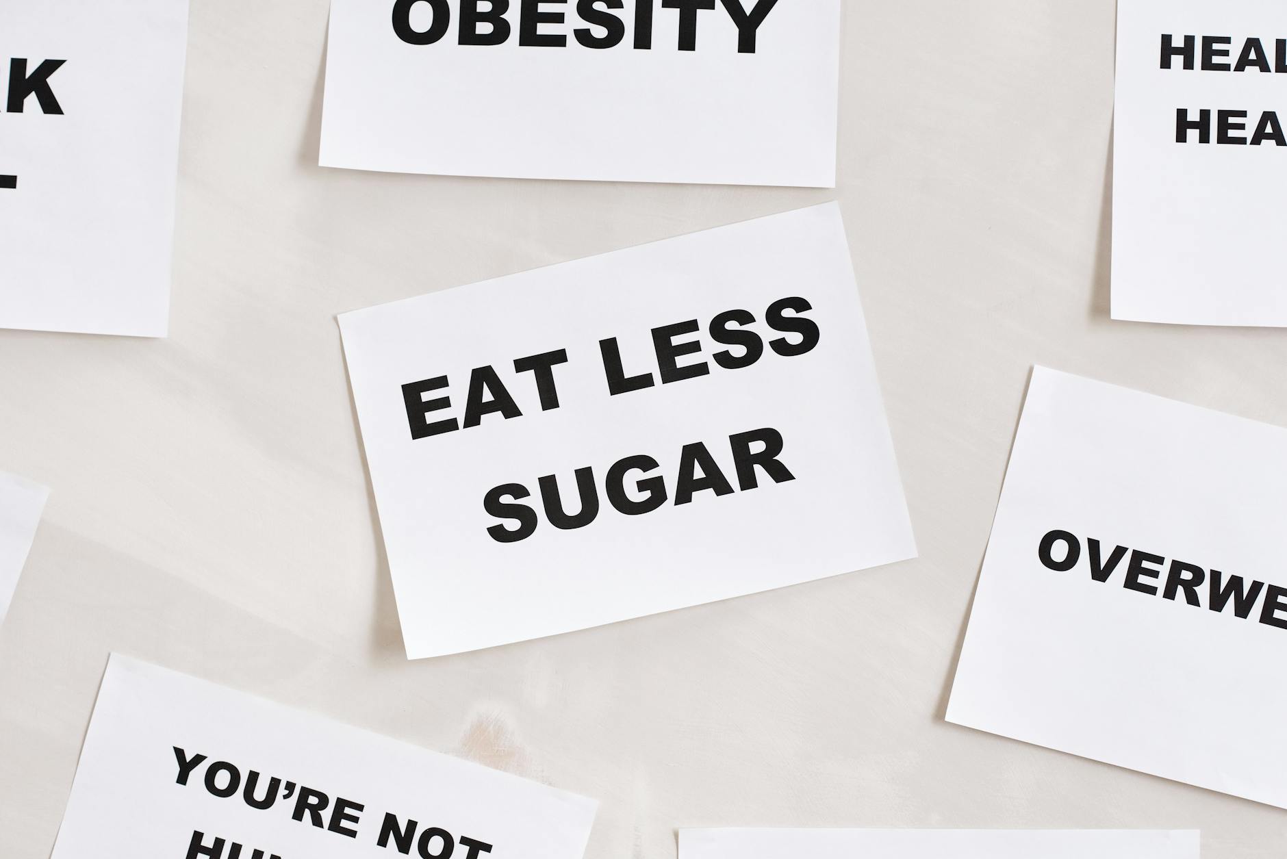 Minimalist photograph of motivational cards with healthy lifestyle messages on a white background. - weight loss tips