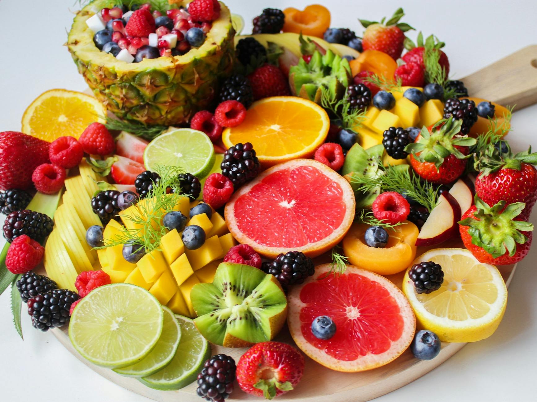 A vibrant assortment of fresh fruits beautifully arranged on a platter, perfect for a healthy and delicious snack. - best anti inflammatory foods