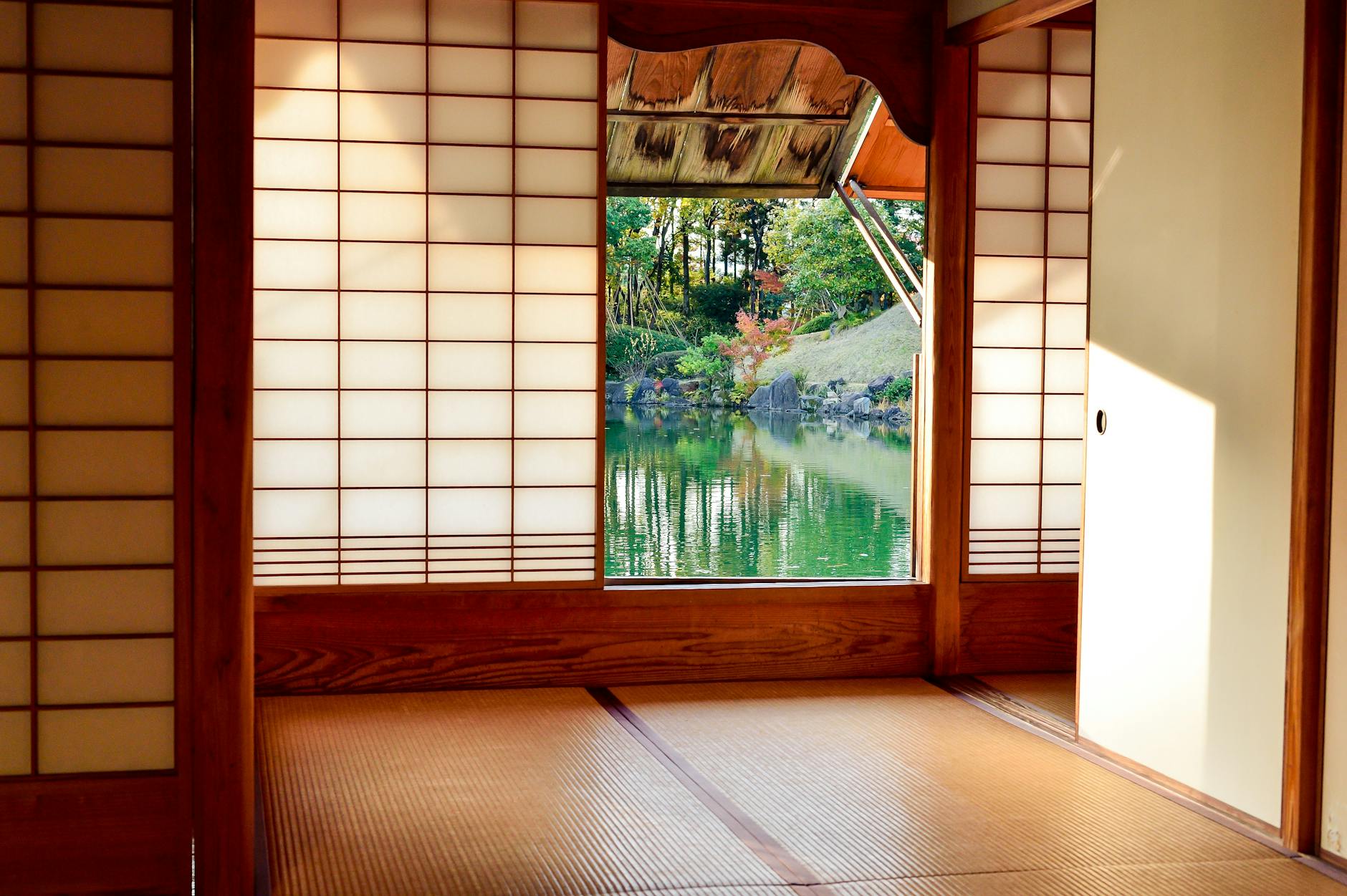 Traditional Japanese room with shoji screens and a view of a serene garden pond. - best magnesium supplement