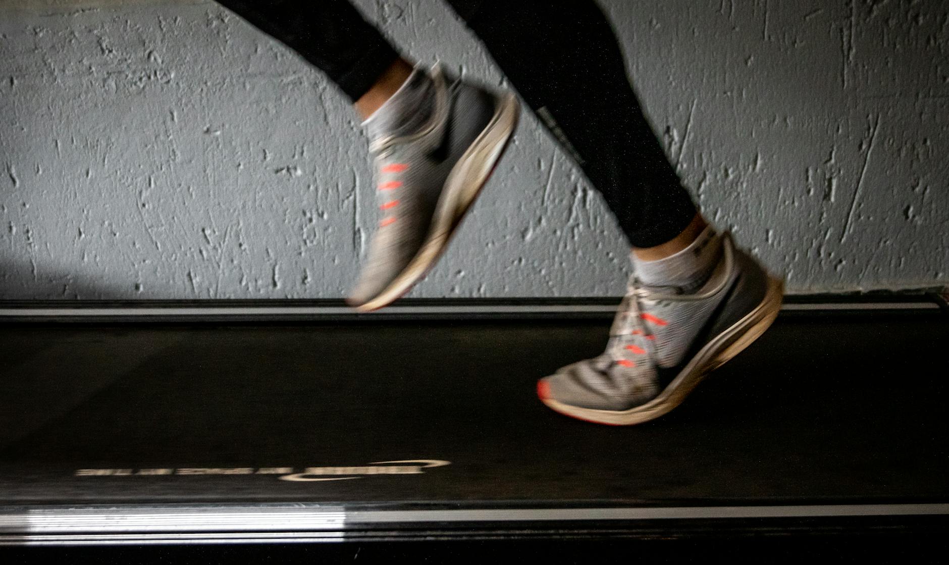 Blurred image of a person running on a treadmill, emphasizing movement and speed. - best treadmill for home