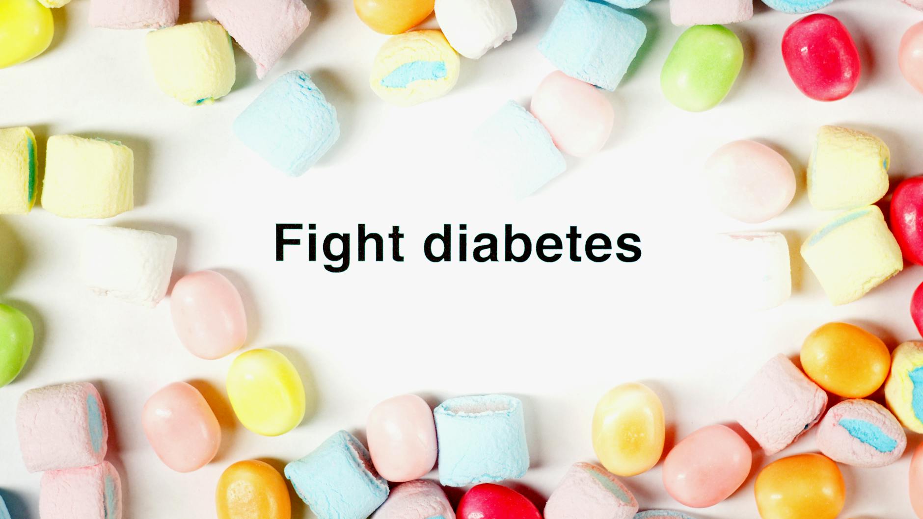 A border of colorful candies surrounds the message 'Fight diabetes' on a white background. - diabetic snack ideas