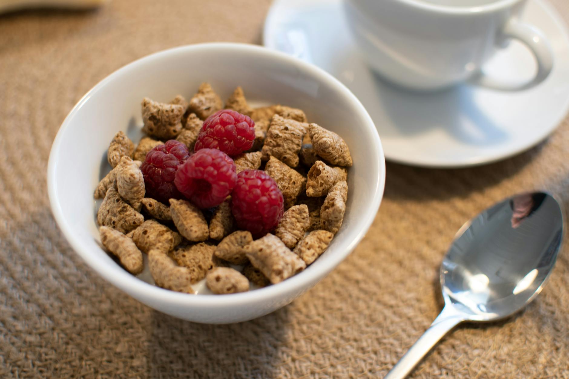 Enjoy a nutritious breakfast with whole grain cereal and fresh raspberries, perfect for a healthy start to your day. - healthy breakfast ideas