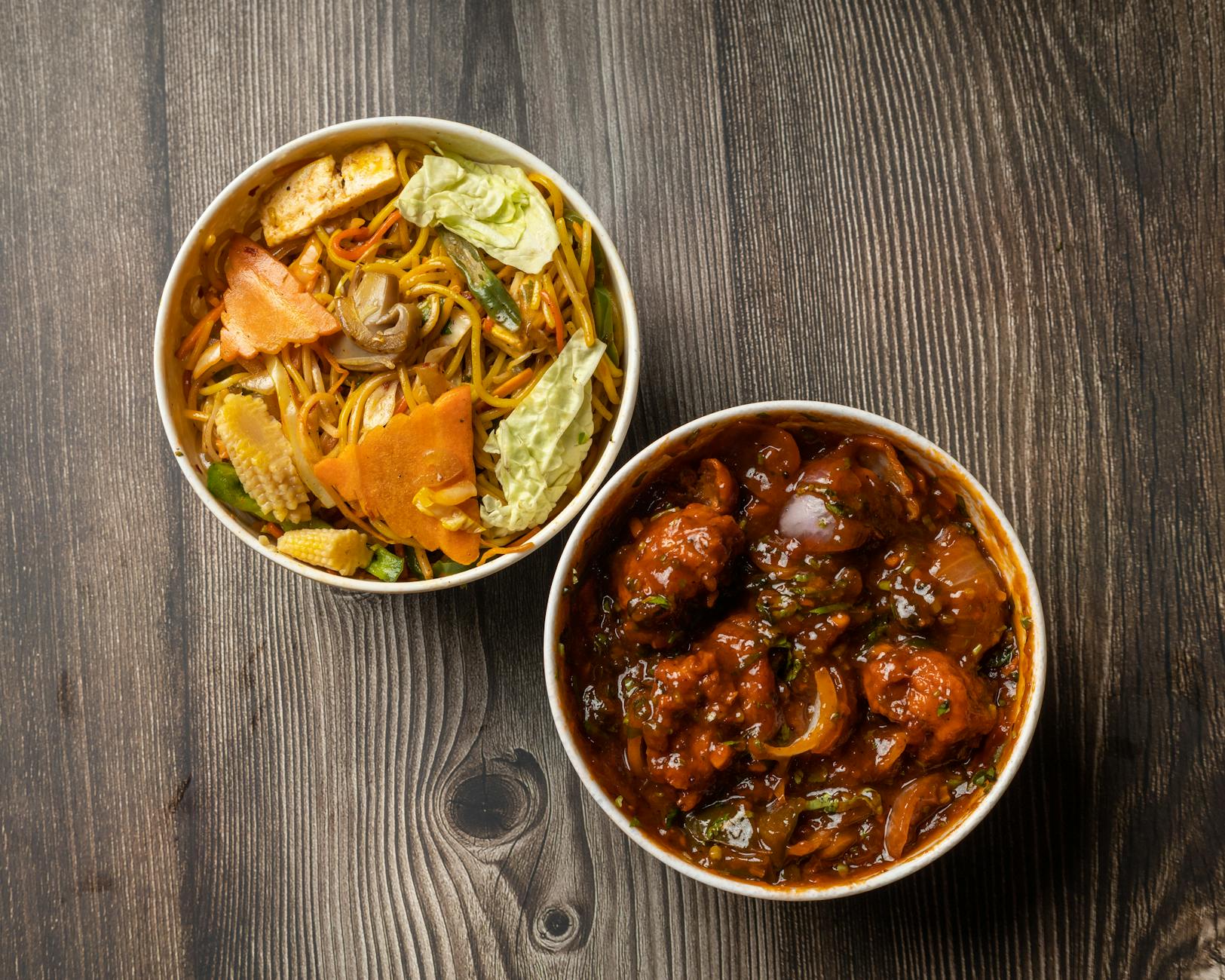 An appetizing two-dish combo featuring Chinese noodles and spicy chilli chicken, perfect for a flavorful meal. - healthy dinner for two