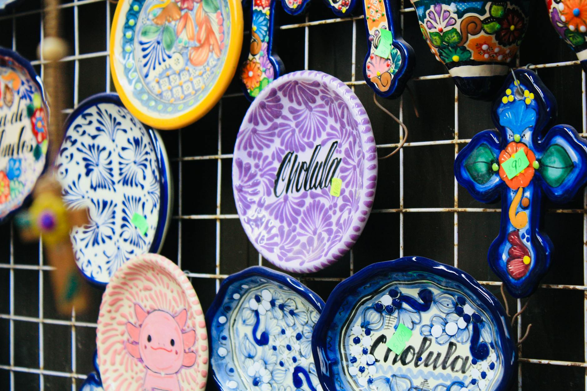 Vibrant Mexican ceramic plates and ornaments displayed in Cholula, showcasing traditional craftsmanship. - iron rich foods