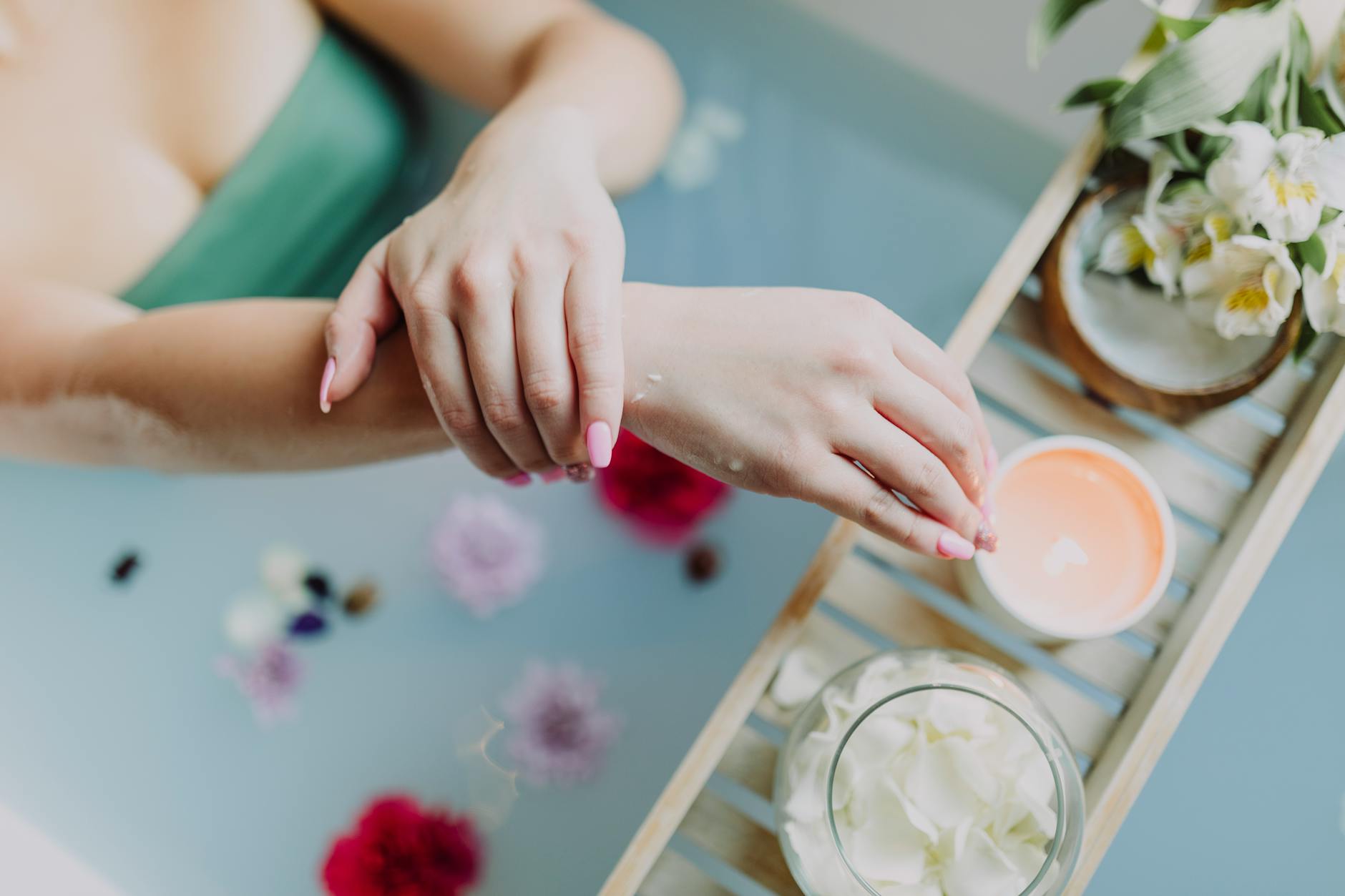 A serene spa experience with flowers, candles, and a relaxing bath. Perfect for self-care and relaxation. - spring wellness rituals