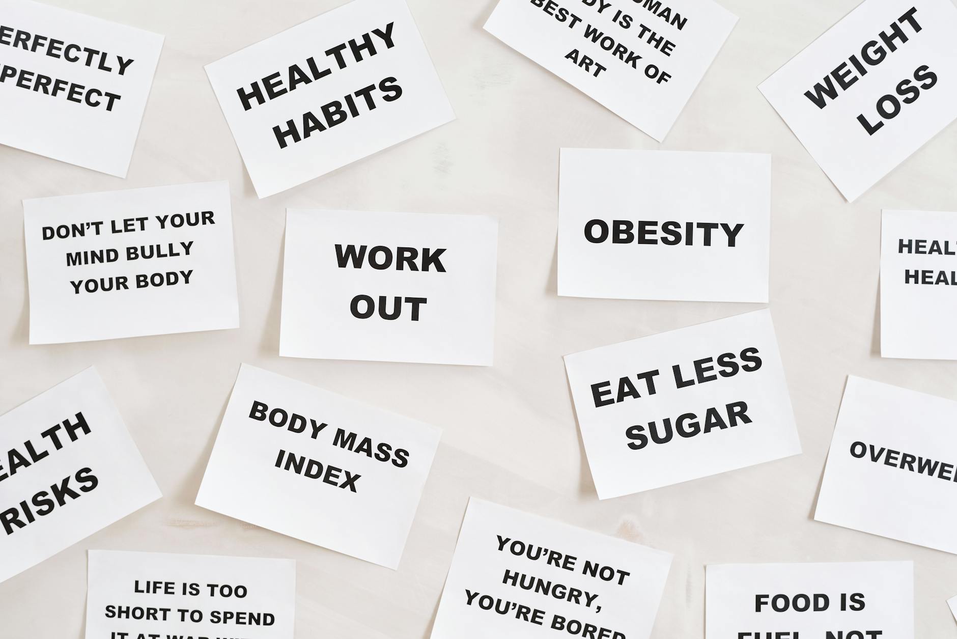 Collection of motivational quotes promoting health and wellness on paper cards. - weight loss tumblr