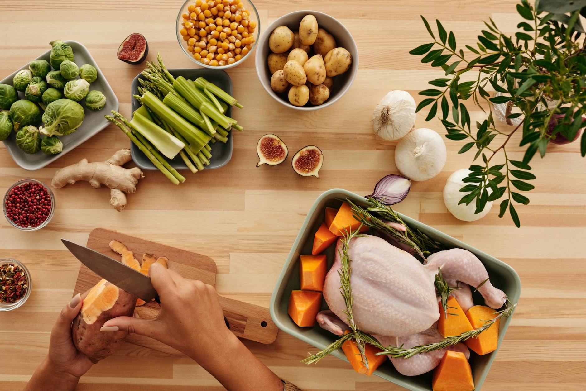 Top view of hands preparing ingredients for a roast with fresh vegetables. - anti-inflammatory foods