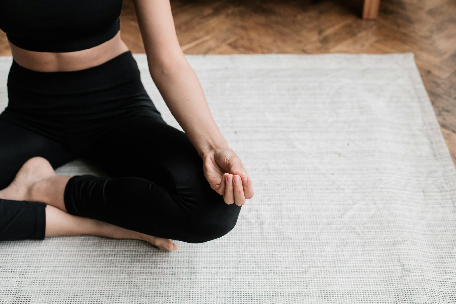 A person meditating indoors, emphasizing relaxation and mindfulness. - mental clarity tips