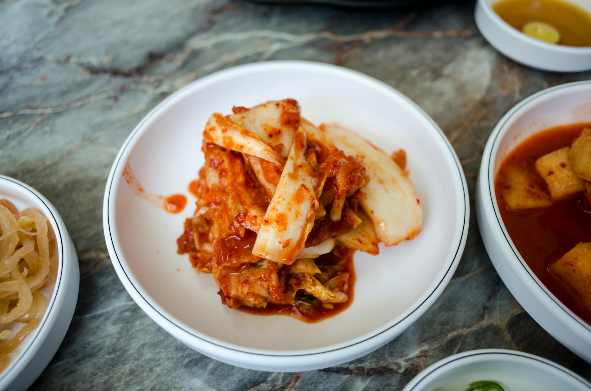 Delicious traditional Korean kimchi served in a white bowl, perfect for Asian cuisine enthusiasts. - benefits of fermented foods