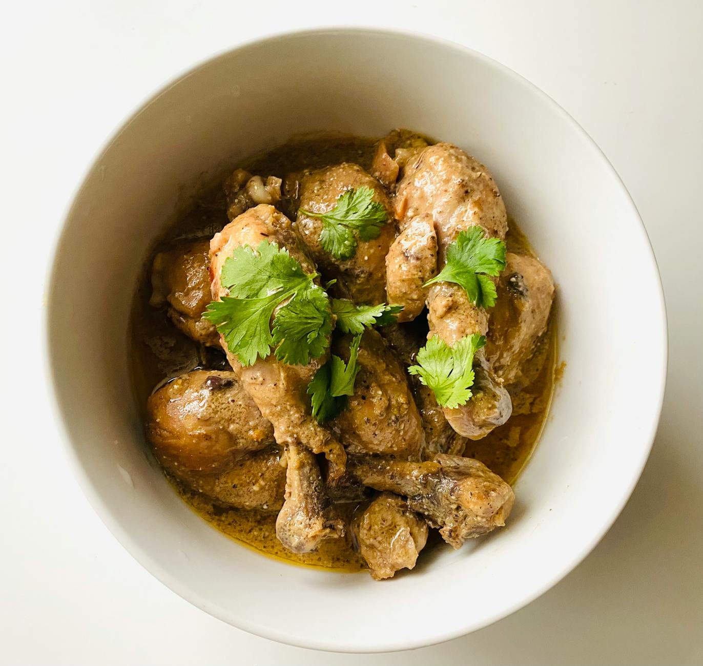 A tempting bowl of chicken curry garnished with fresh cilantro, perfect for Asian cuisine lovers. - easy chicken recipes