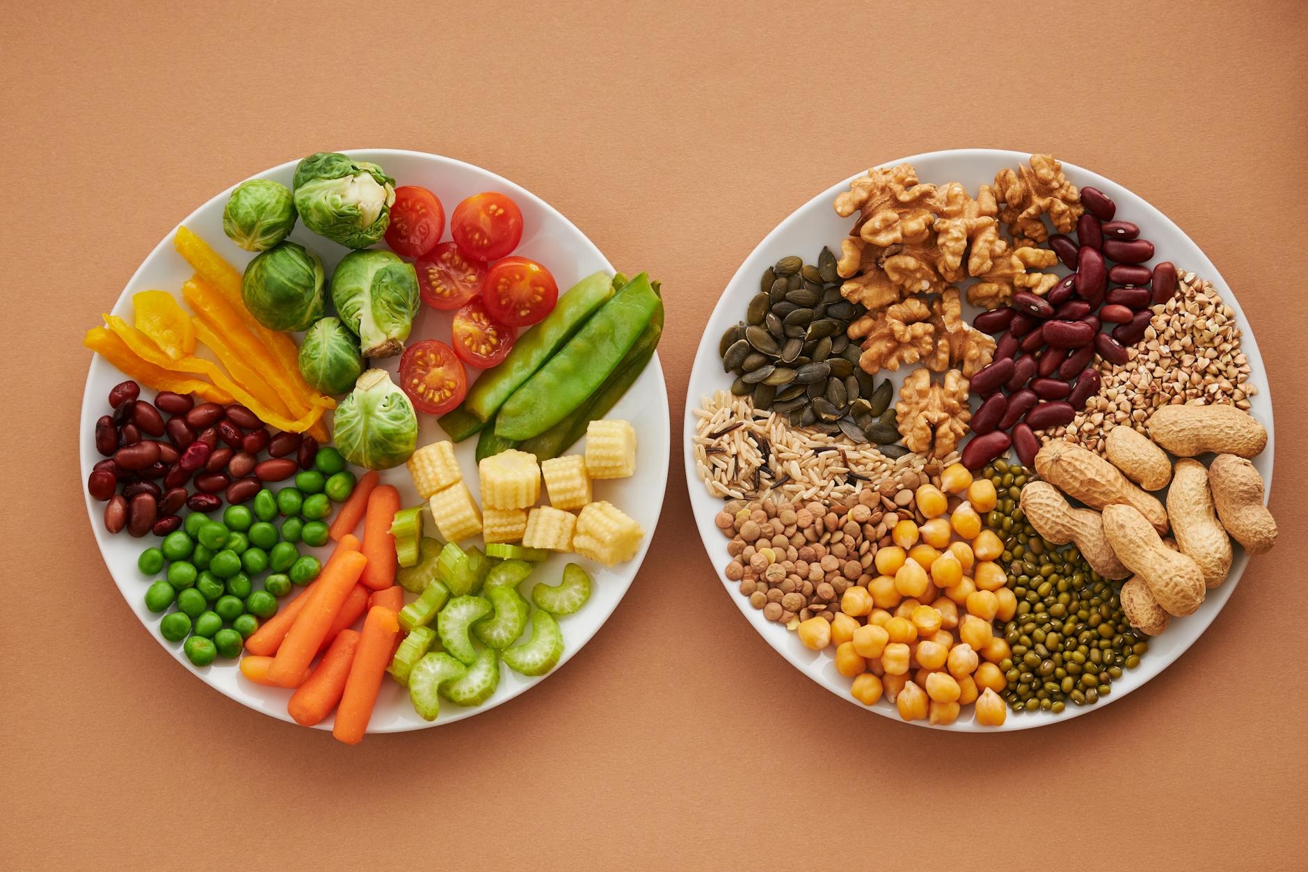 A vibrant flatlay of colorful vegetables and nuts showcasing a balanced diet concept. - fiber foods fullness