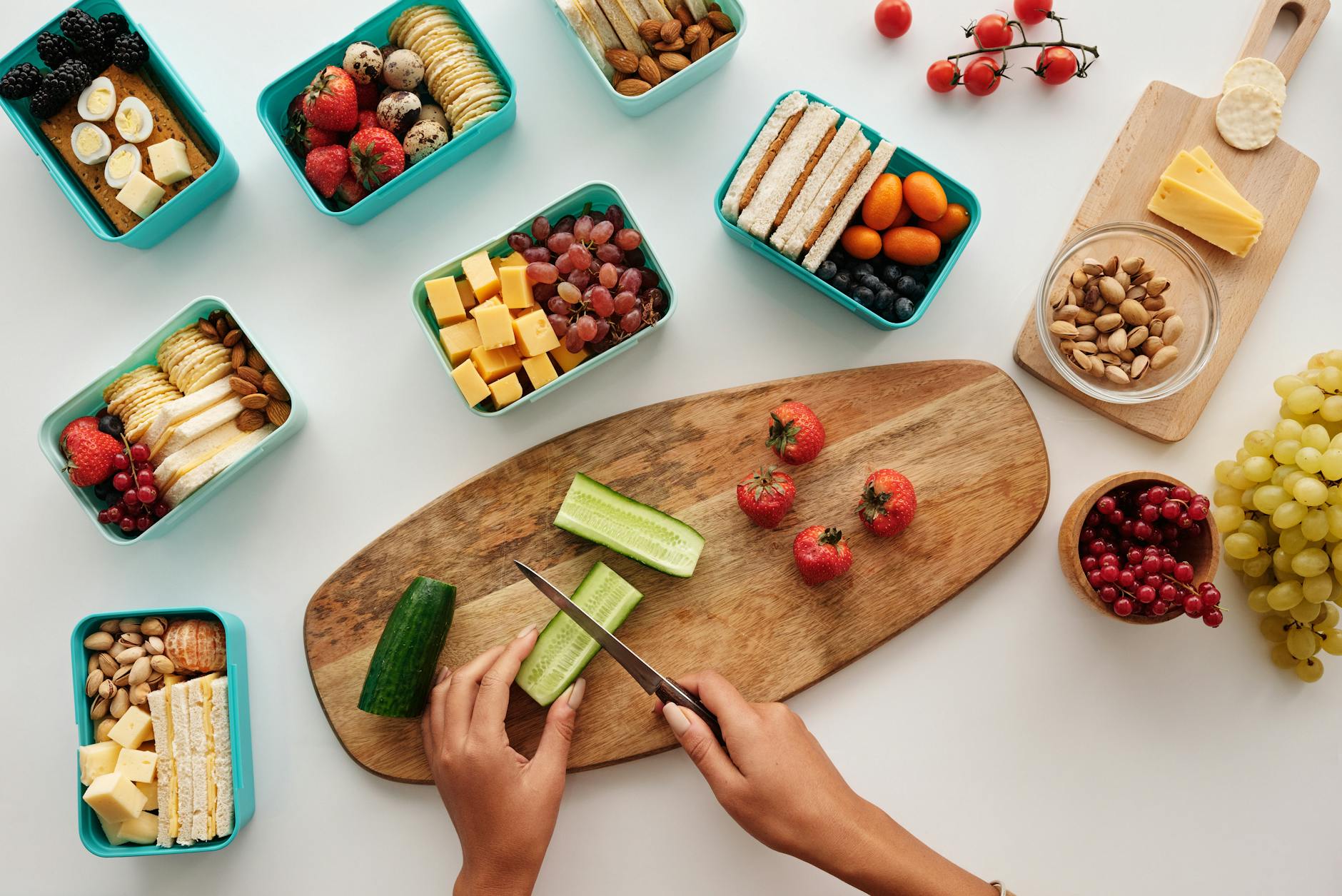 Overhead view of fresh fruit and vegetables being prepared for a healthy lunch. - healthy lunch prep