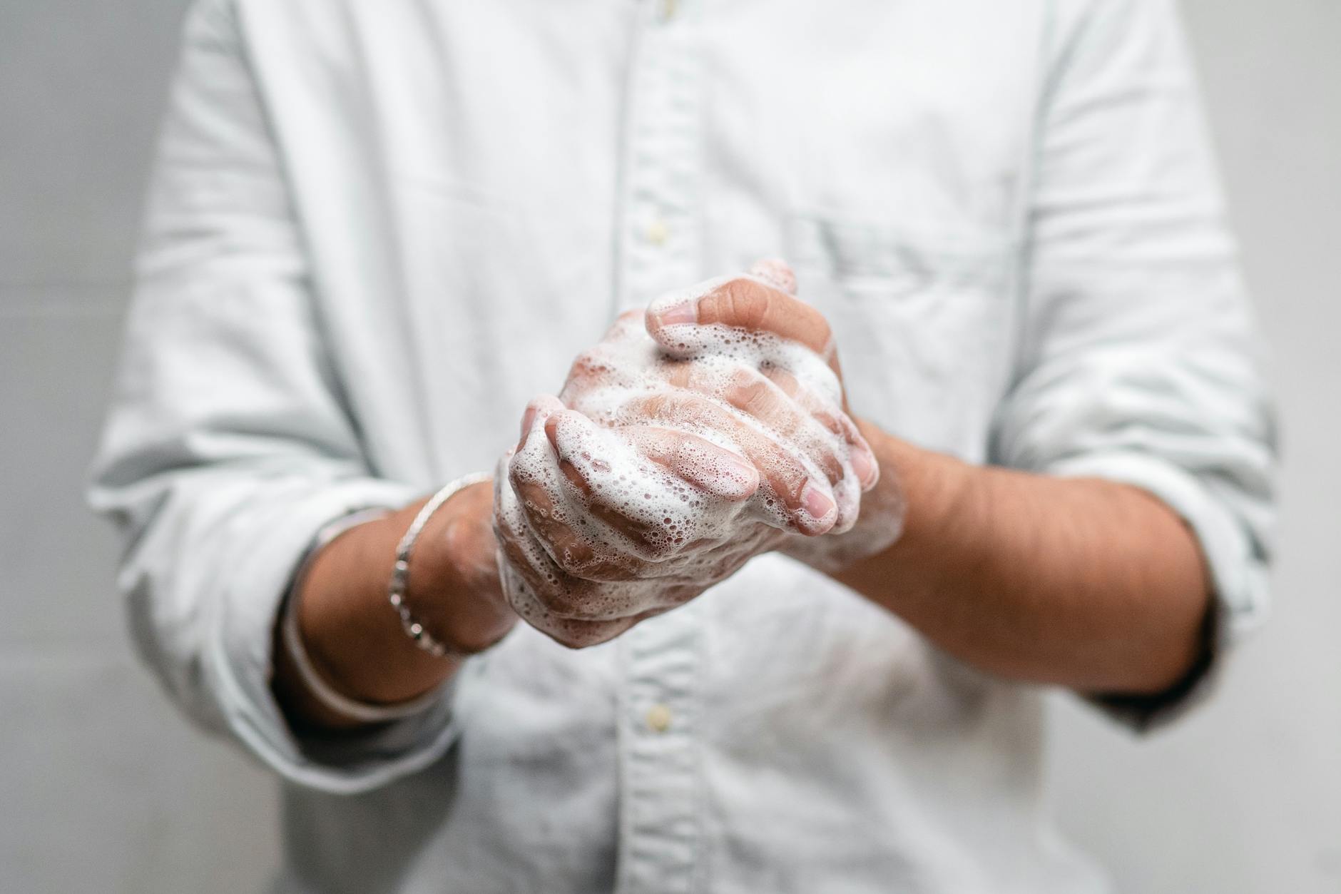 Close-up of hands lathered with soap for thorough cleaning and hygiene. - personal hygiene tips