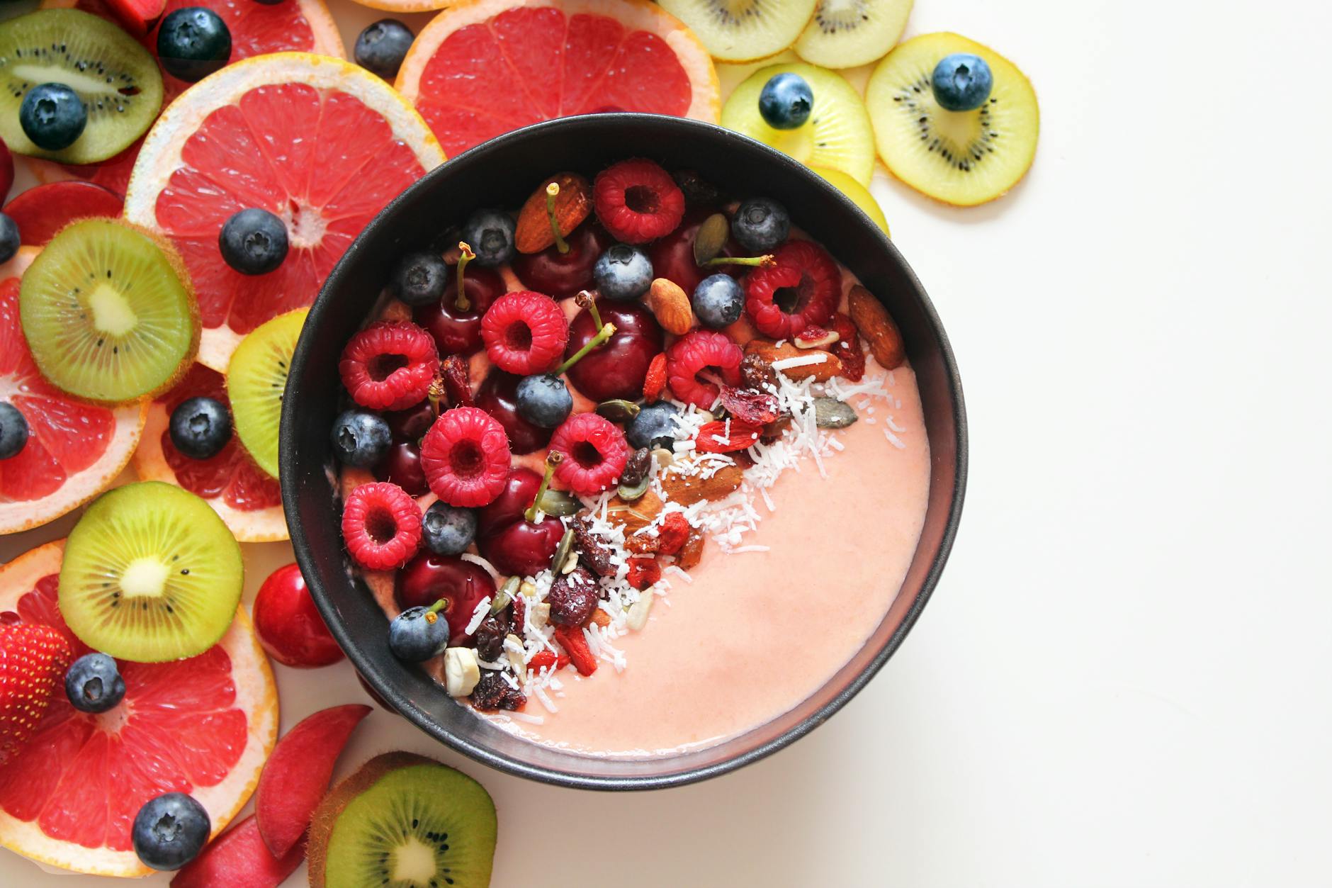 Colorful smoothie bowl with berries and tropical fruits, perfect for a healthy breakfast. - spring superfoods energy