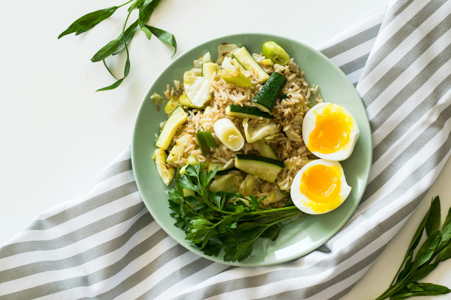 Delicious rice meal with zucchini, greens, and soft-boiled egg, perfect for a healthy diet. - weight watchers recipes