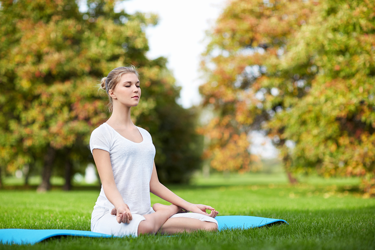 Person in meditative yoga pose