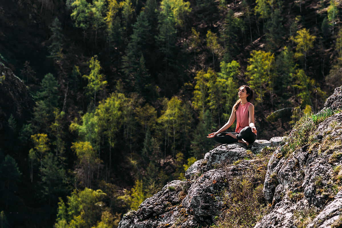 Person doing meditation in nature
