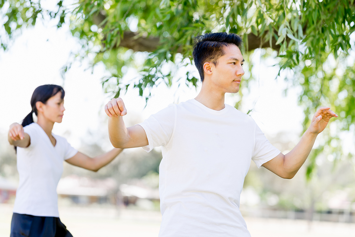 Person practicing Tai Chi as a form of mind-body exercise