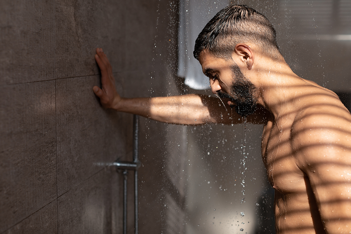 Person taking a cold shower, part of the ice hack weight loss strategy