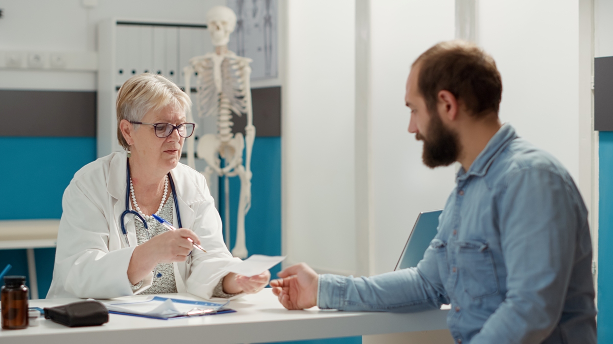 Primary care physician talking to a patient