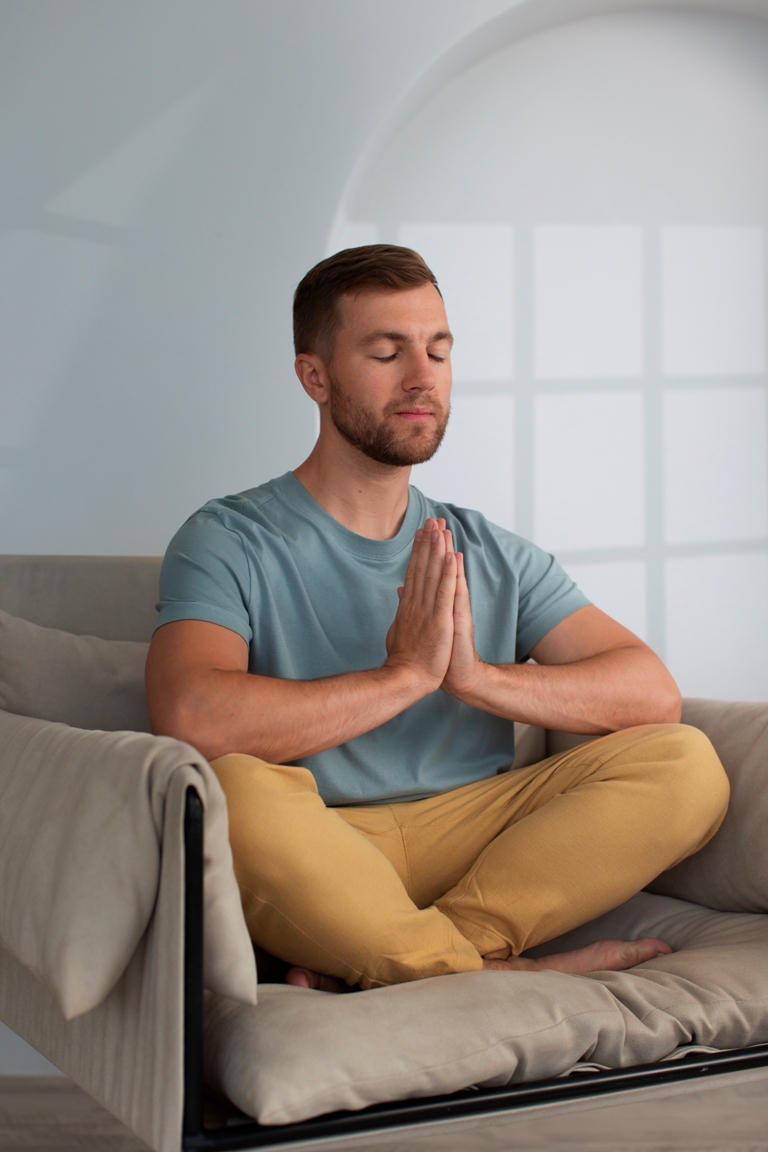 Person practicing mindfulness meditation to stop worrying about health
