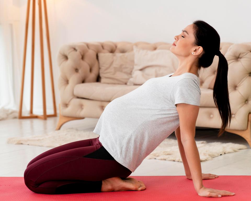 Pregnant woman doing prenatal exercise to support placenta health